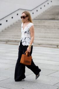 sonia-lyson-wears-shoes-dior-black-wide-leg-pants-white-news-photo-1722268398